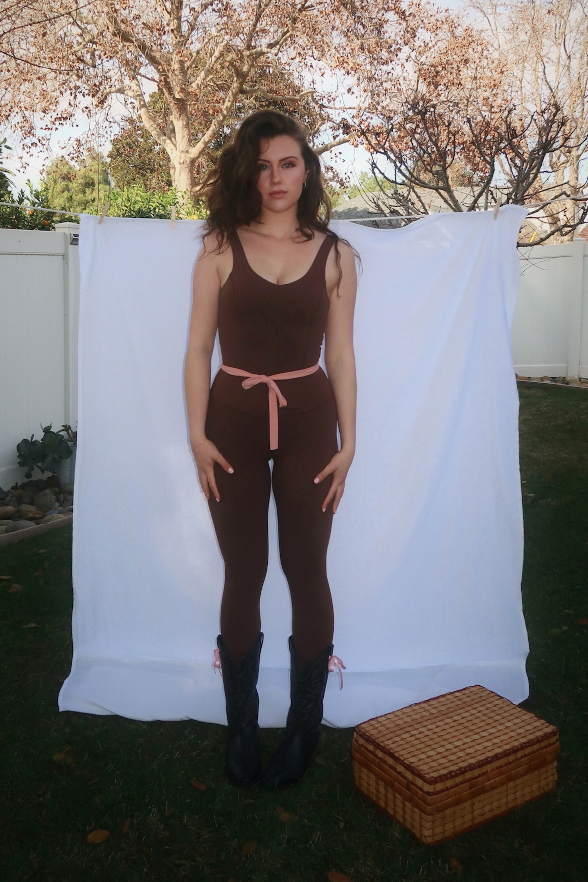 model standing in front of white backdrop wearing Fawn Jumpsuit